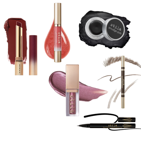 Collection of Stila makeup products including lipsticks, eyeliner, and brow products on a white background.